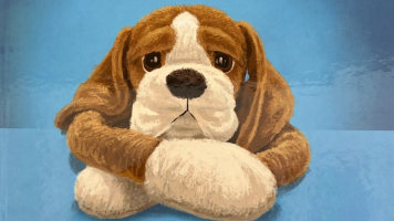 sad dog with arms crossed in front of blue background