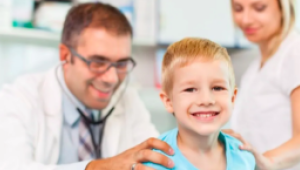 boy patient being examined by doctor with mom in the room