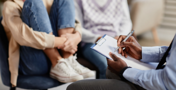 doctor speaking to teen patient