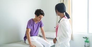 doctor with teen patient