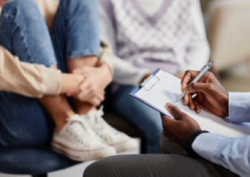 doctor speaking to teen patient