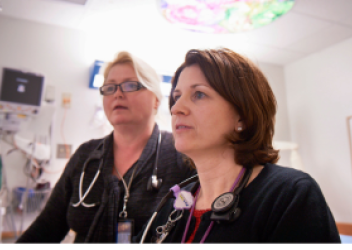 CHOP nurses looking at computer screen