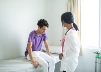 doctor with teen patient