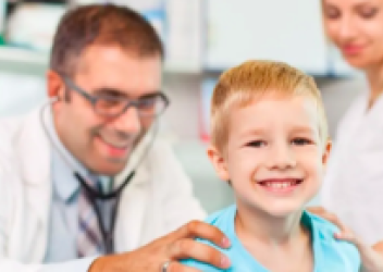 boy patient being examined by doctor with mom in the room